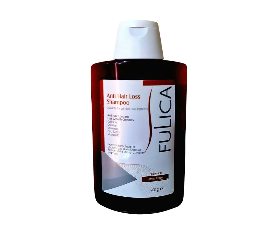 A plastic wide bottle with white lid contains red color shampoo